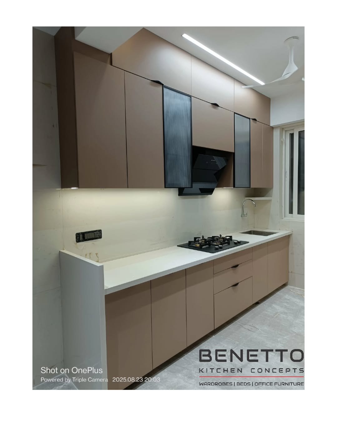 Benetto modular kitchen with tall cabinets, hob, and under-cabinet lighting